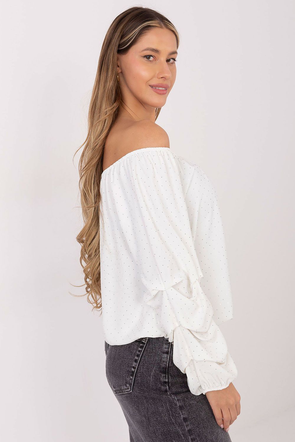 Side angle-2 of beige blouse highlighting neckline and elegant sleeve design