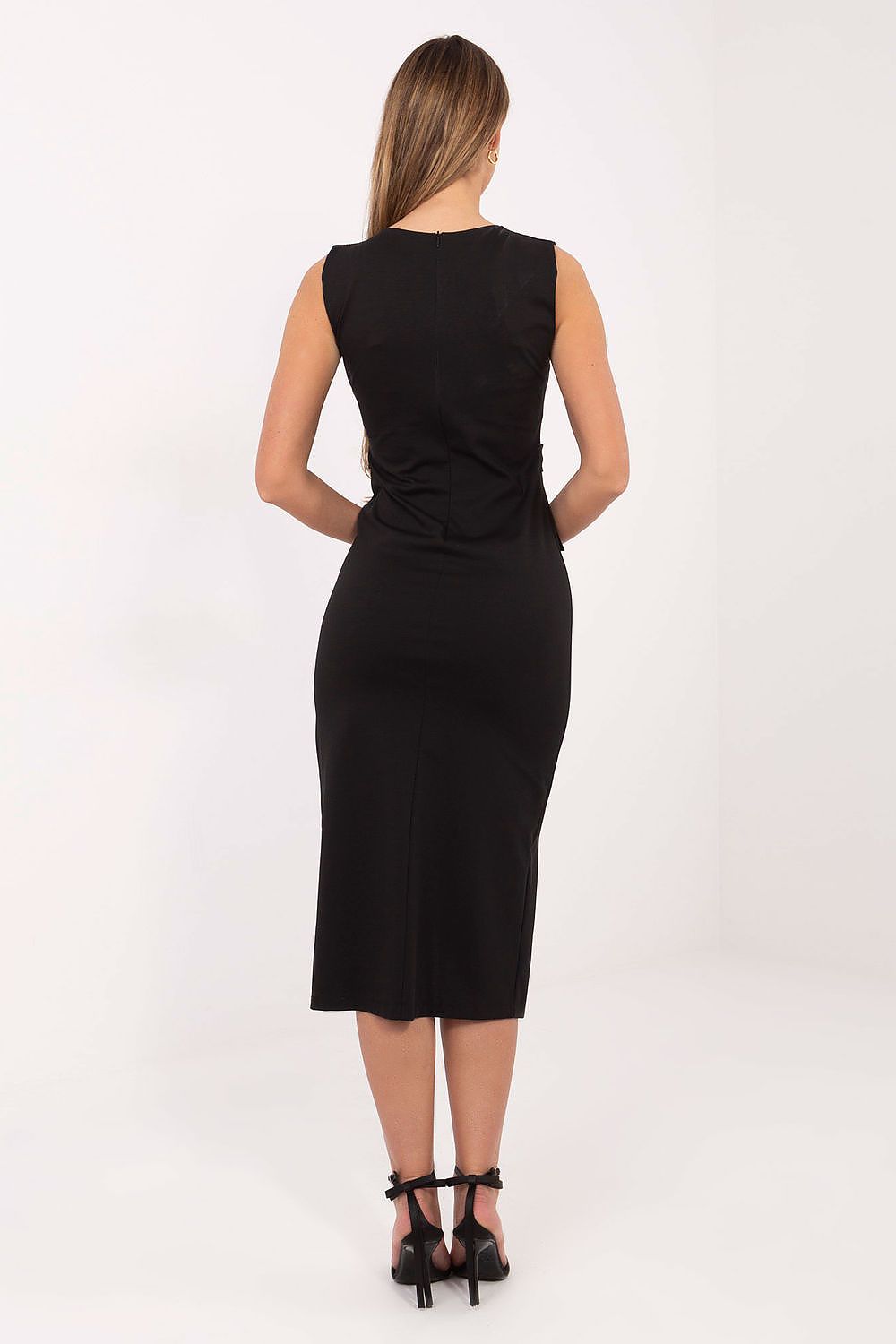 rear angle of black pencil dress showing fitted shape and slit