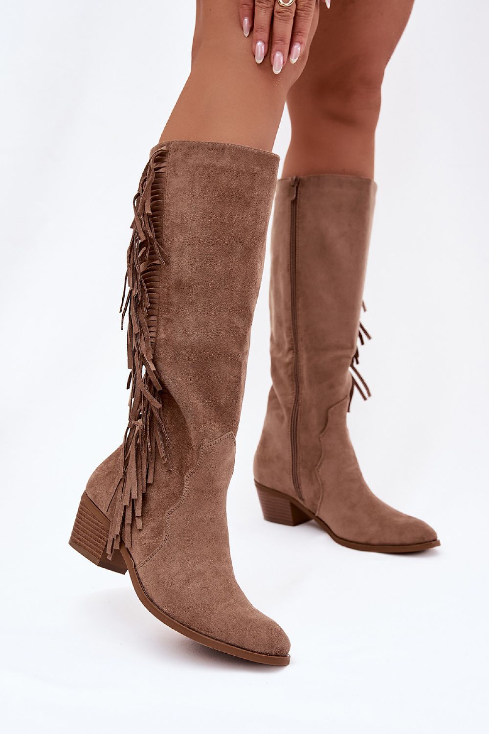 Brown suede knee-high boots with fringes on a white background
