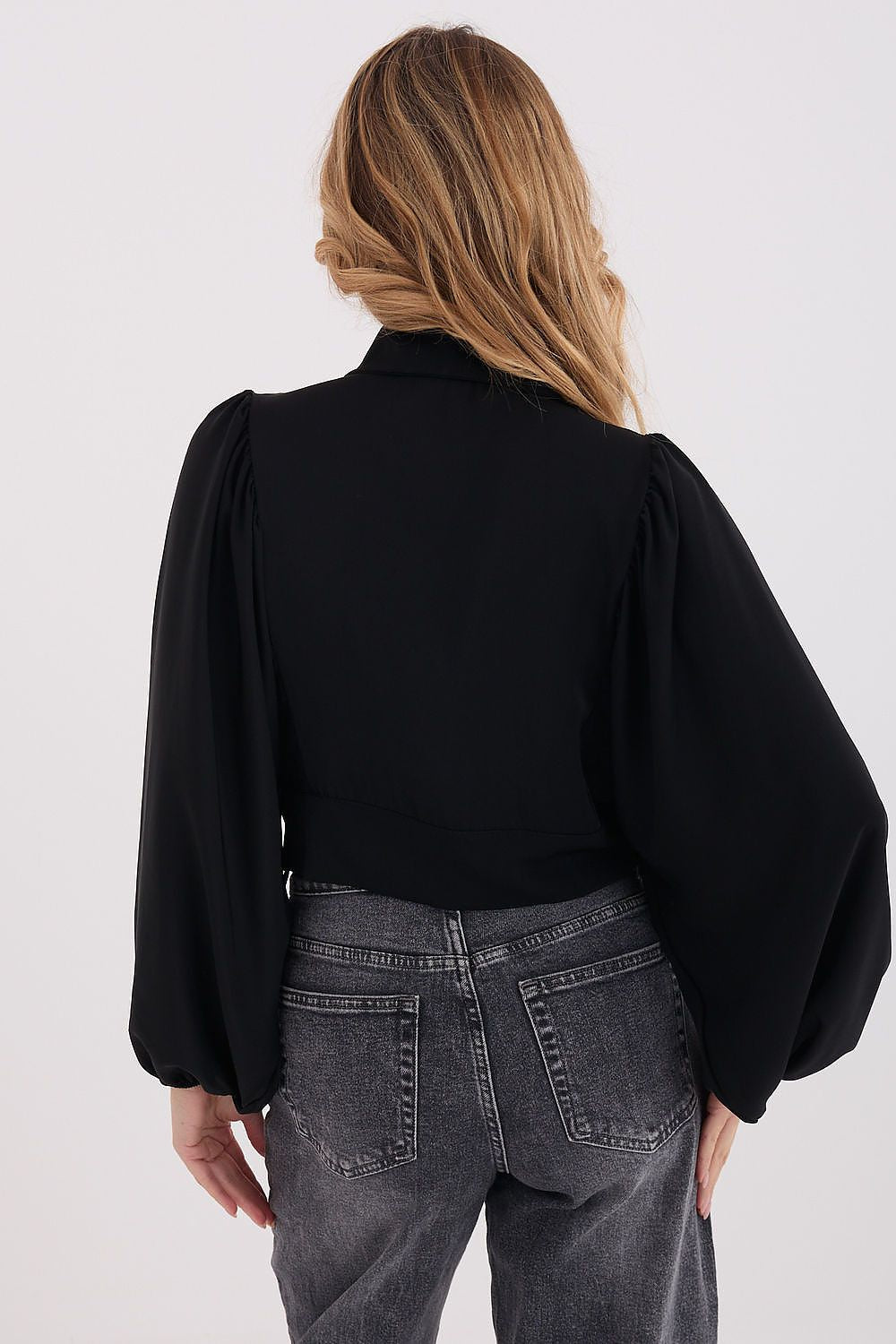 Front view of elegant classic puff-sleeve shirt with tie hem in black, rear view