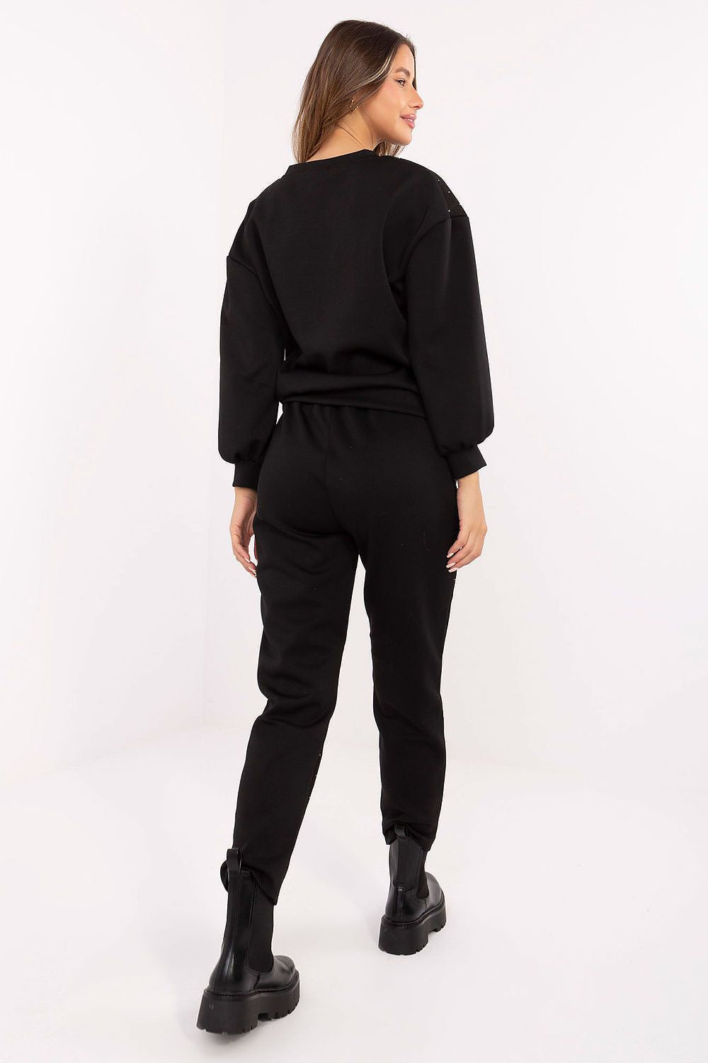 Close-up of lace and jet detailing on black hoodie and pants, in black, rear view