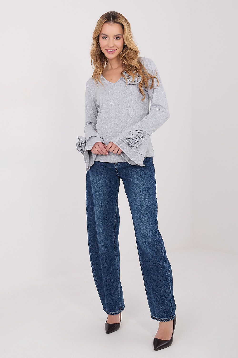  Grey longsleeve blouse with floral accents and bell sleeves.