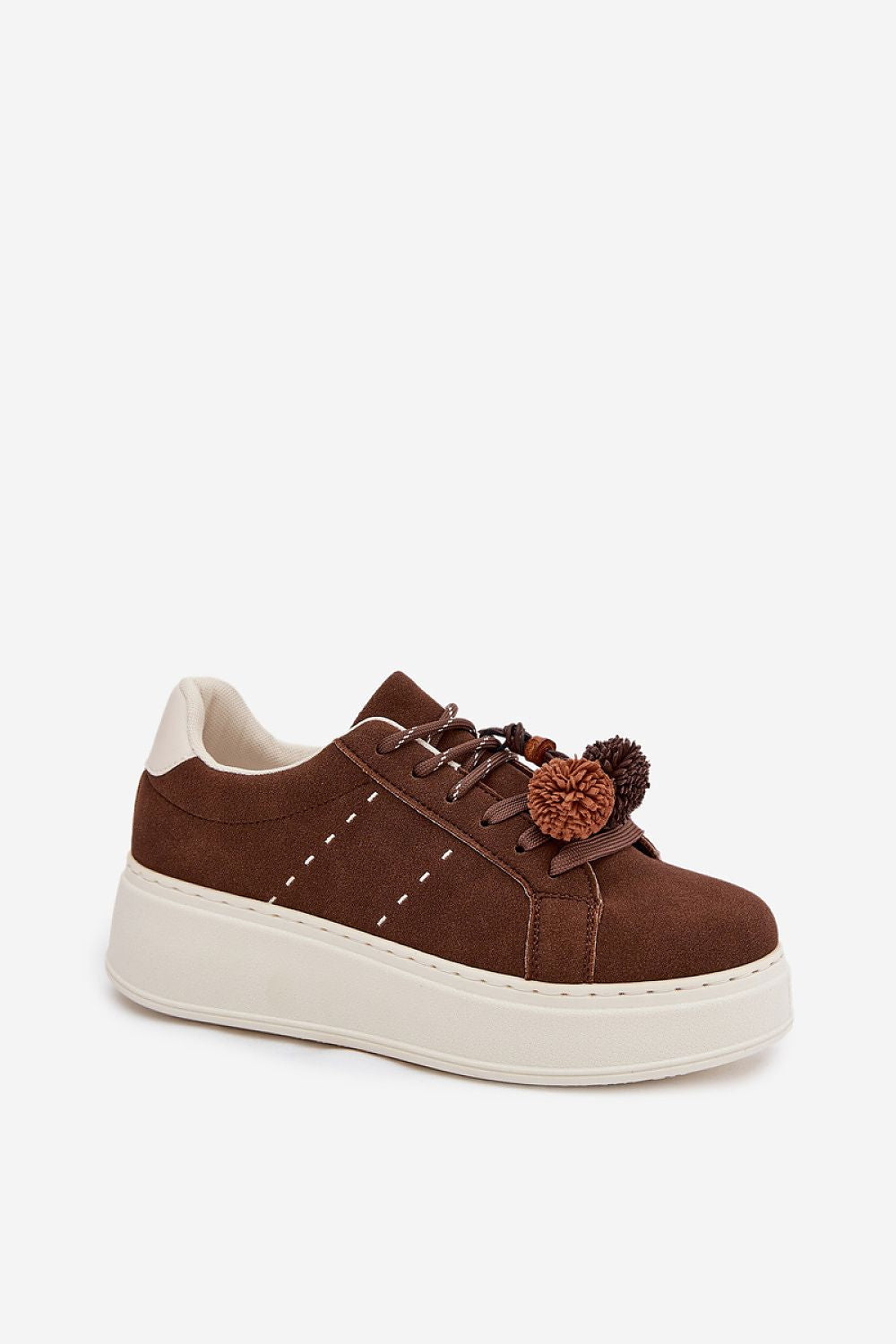 Brown sneaker with a pom-pom on a white background