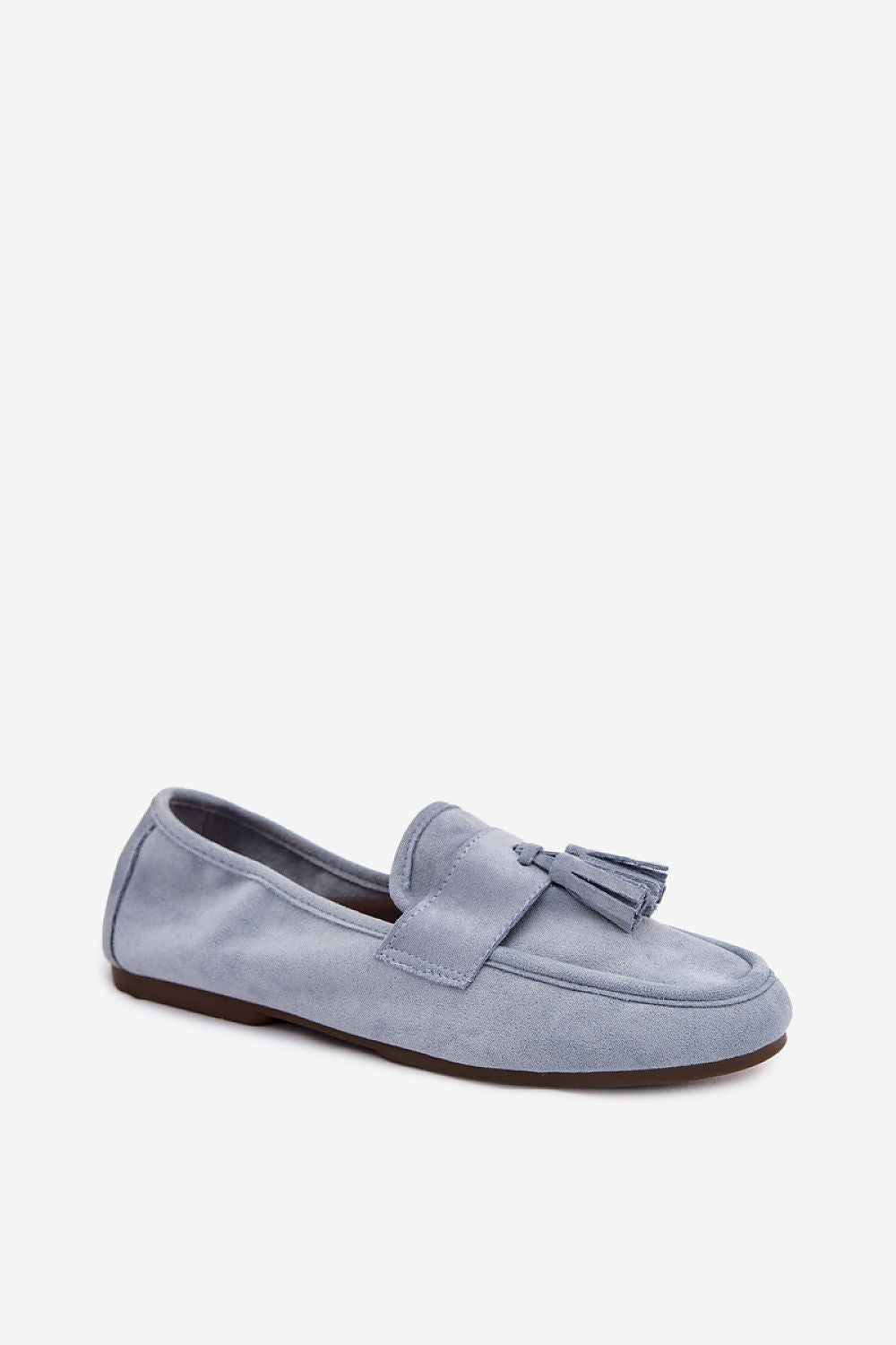 Blue suede loafer with a tassel on a white background