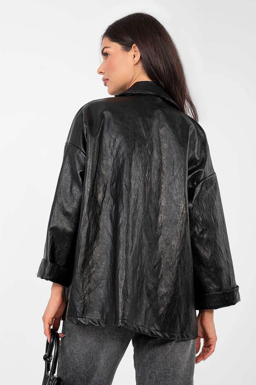  Black smooth-finish blazer shown to highlight timeless cut and long sleeves.