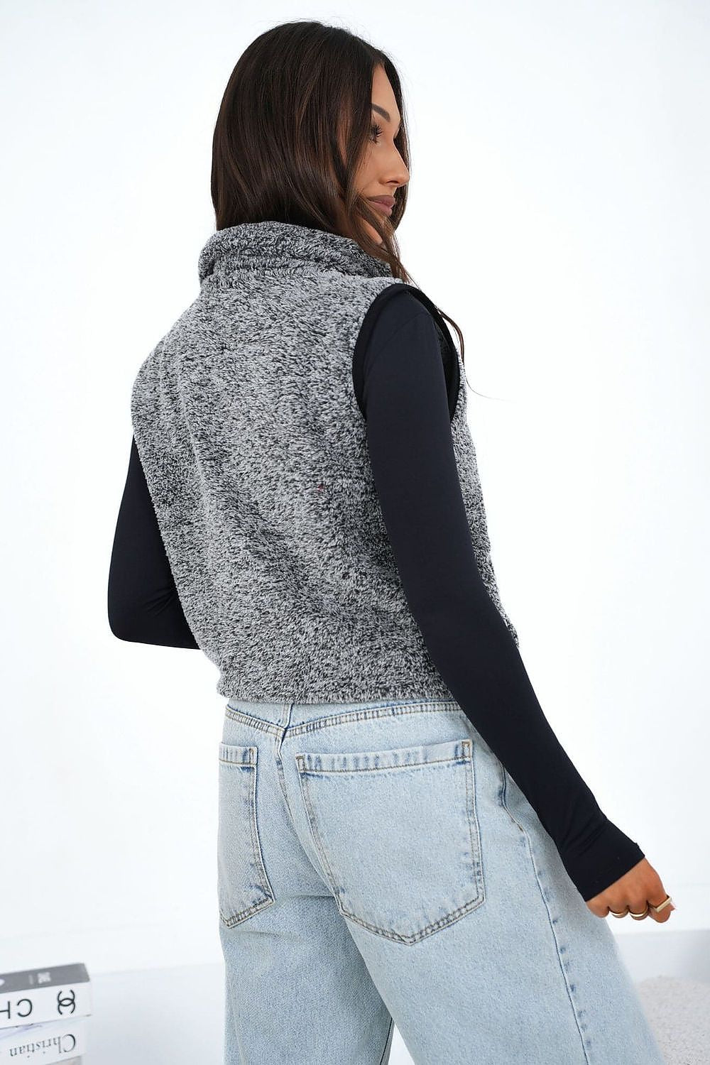  faux fur gilet with zip fastening, stand-up collar and convenient slip pockets.