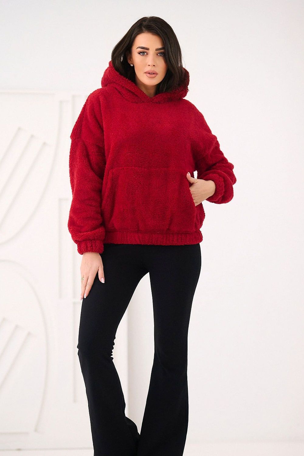  Women's red teddy sweatshirt styled with jeans for everyday wear