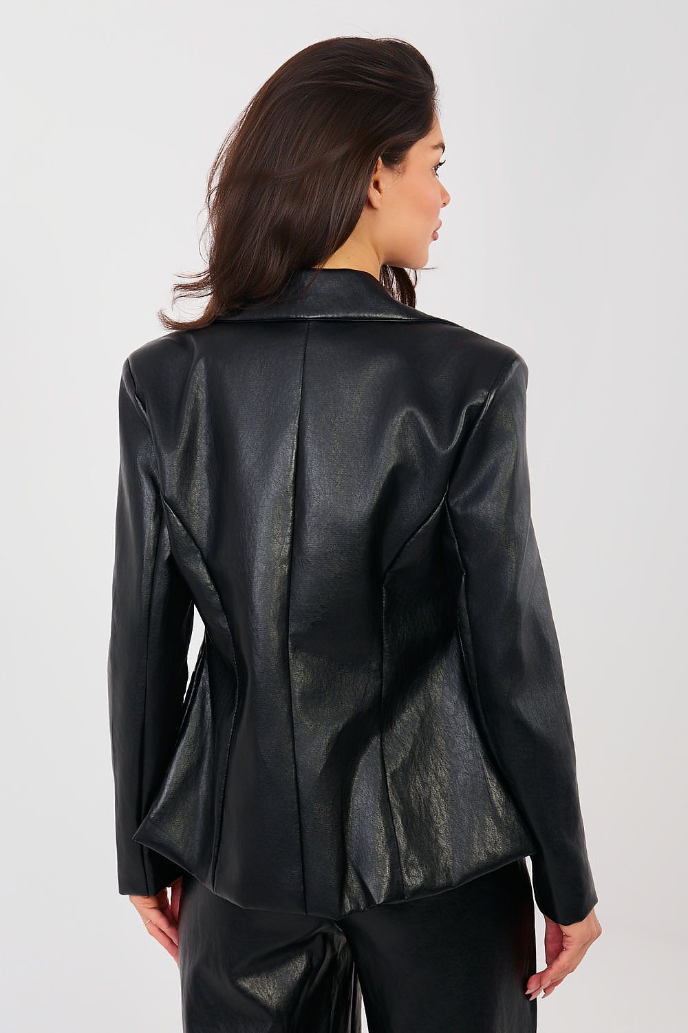 Person wearing a black leather jacket on a white background