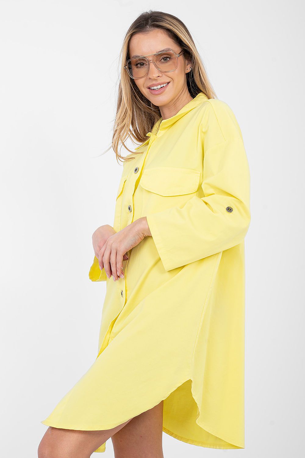Woman wearing a yellow raincoat on a white background