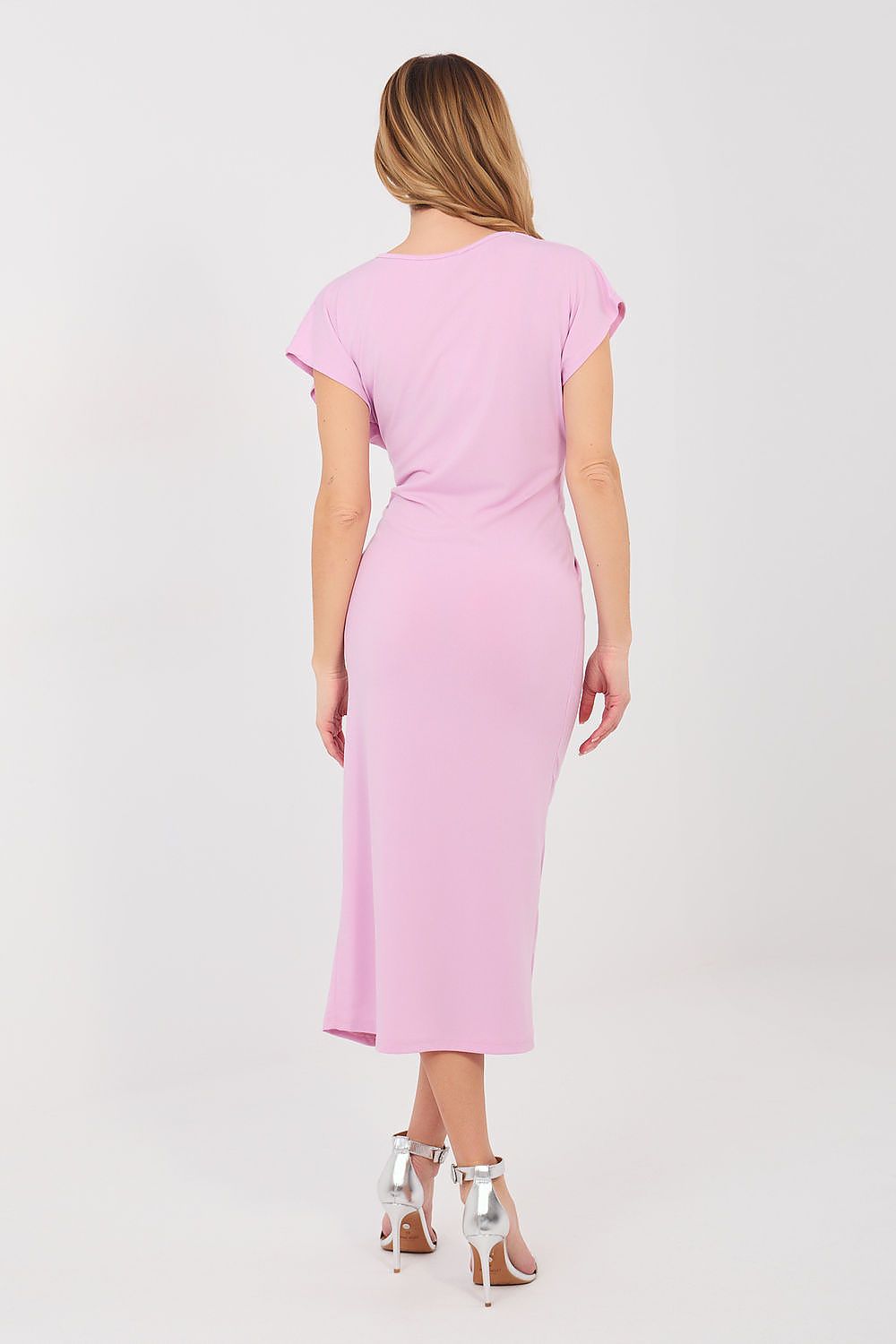 Woman wearing a pink dress on a white background