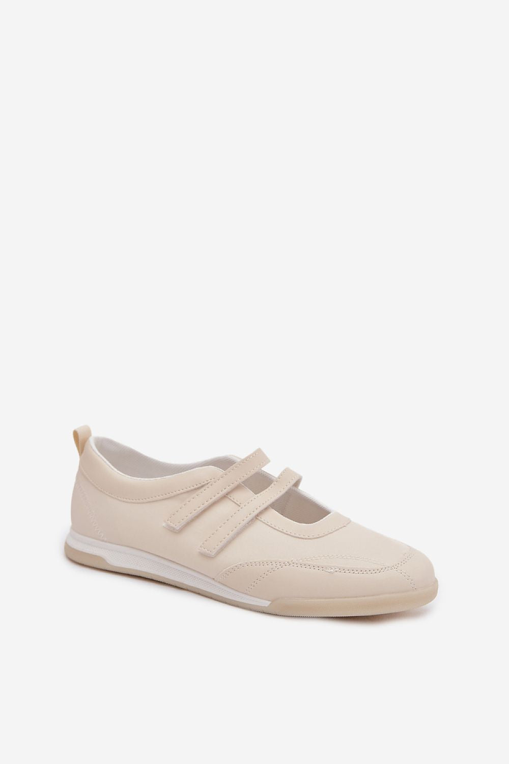 Beige sneaker with velcro straps on a white background