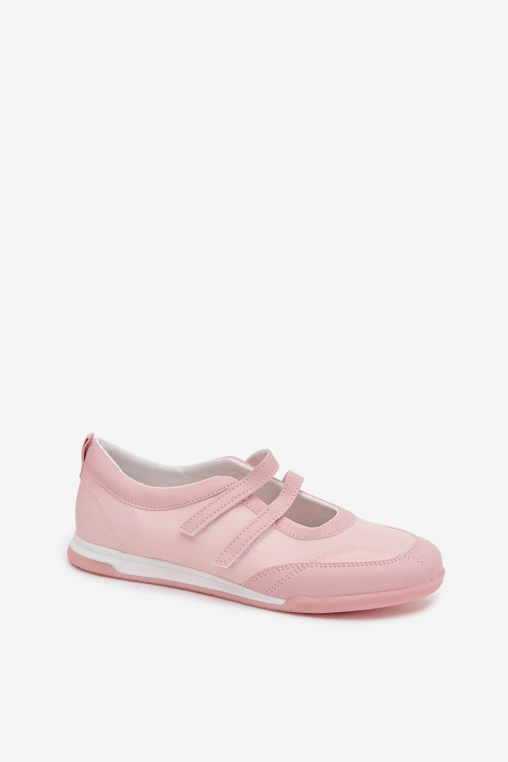 Pink sneaker with a white sole on a light beige background
