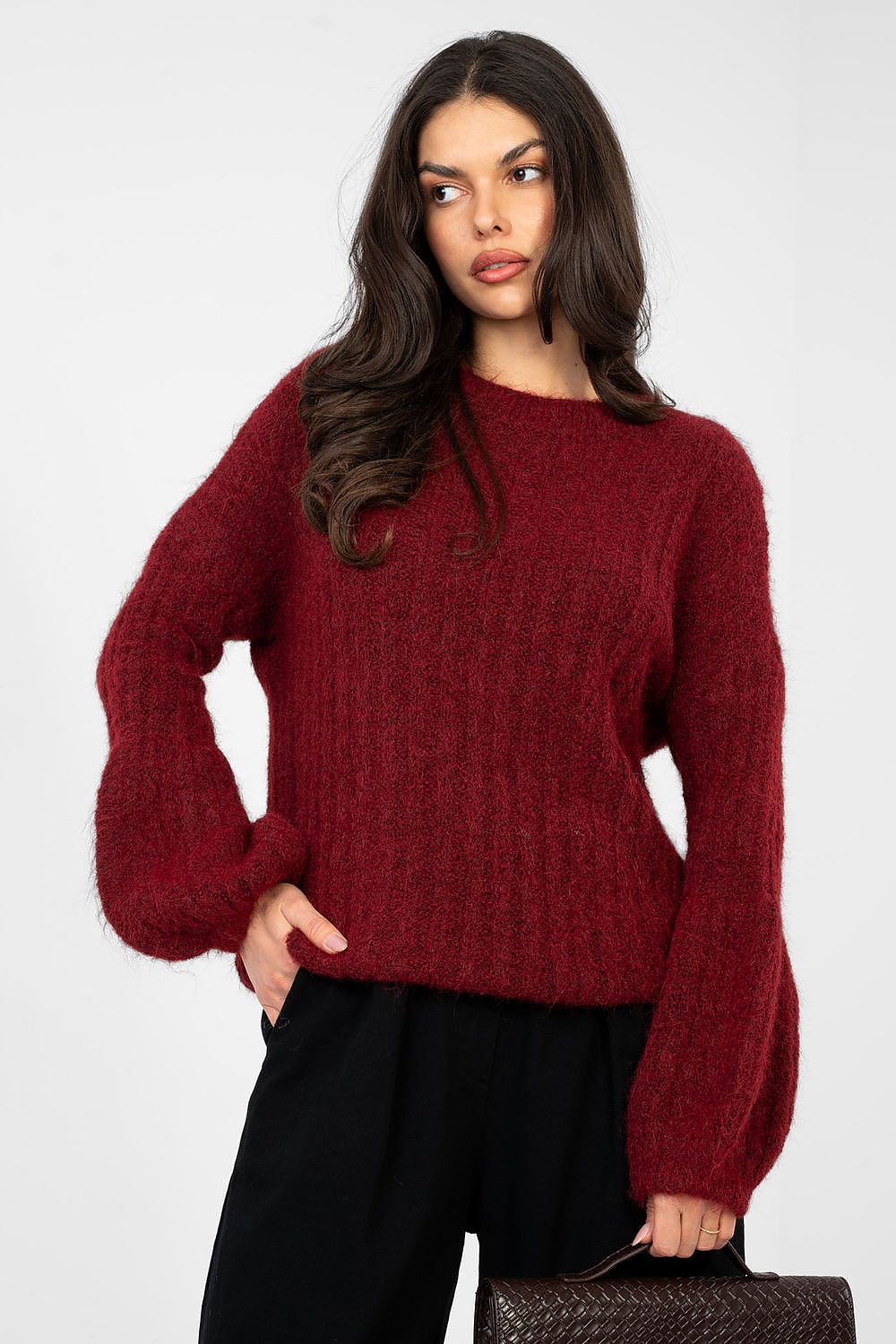 Woman wearing a red sweater on a white background