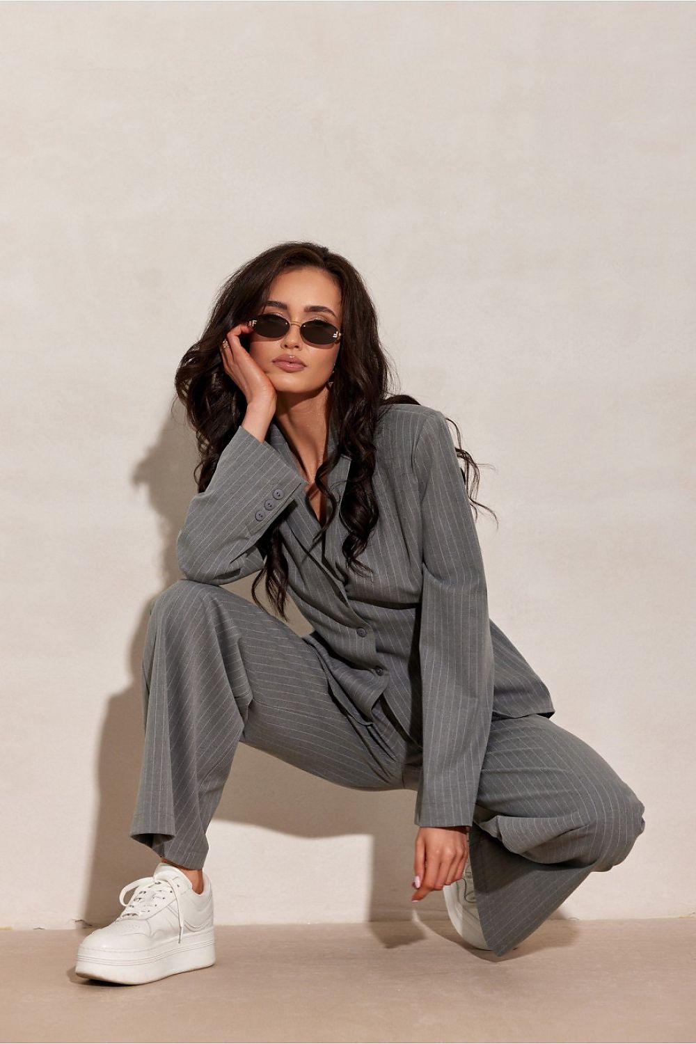  grey wide leg striped trousers with tailored fit kneeling down