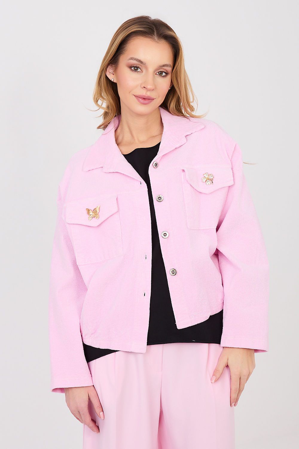 Woman wearing a pink jacket with a white background