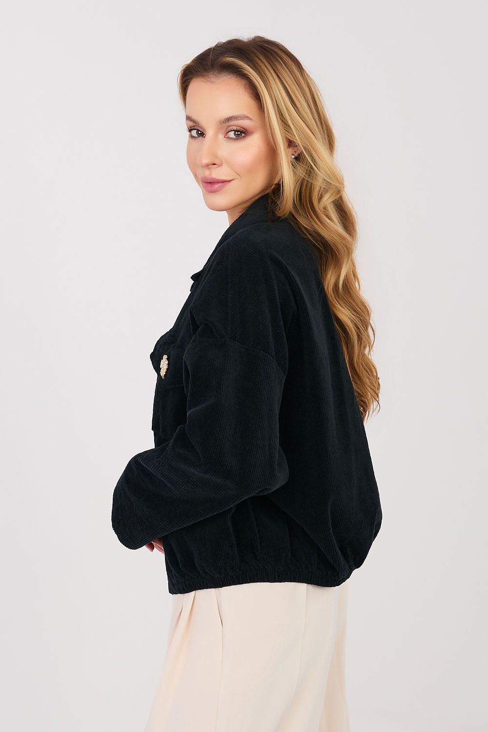 Woman wearing a black jacket on a white background