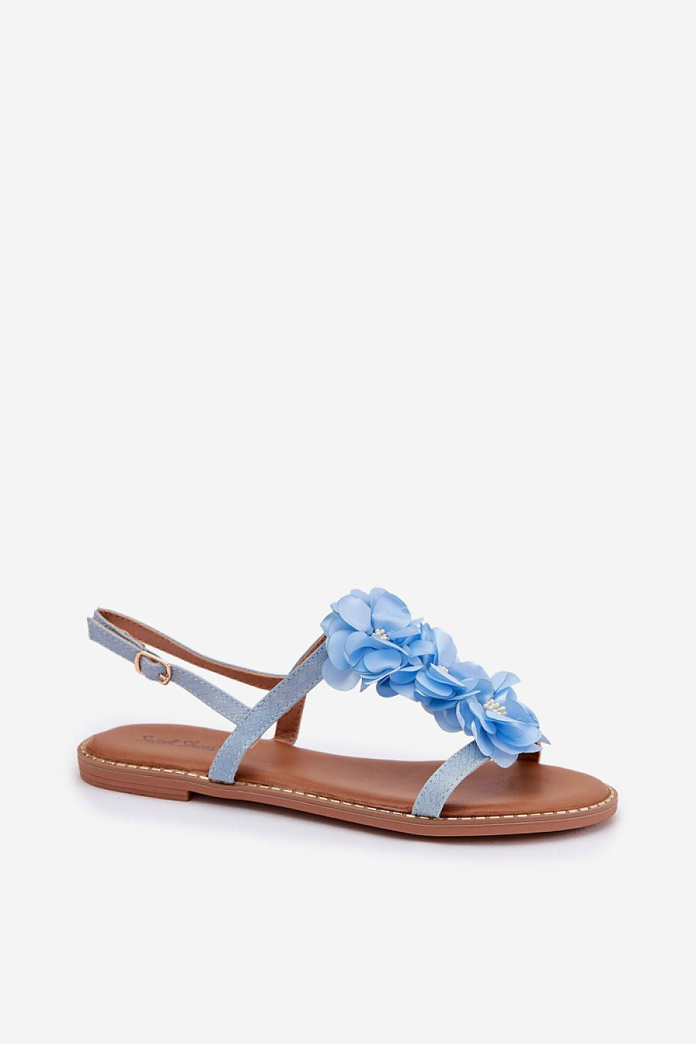 Blue sandal with floral design on a white background