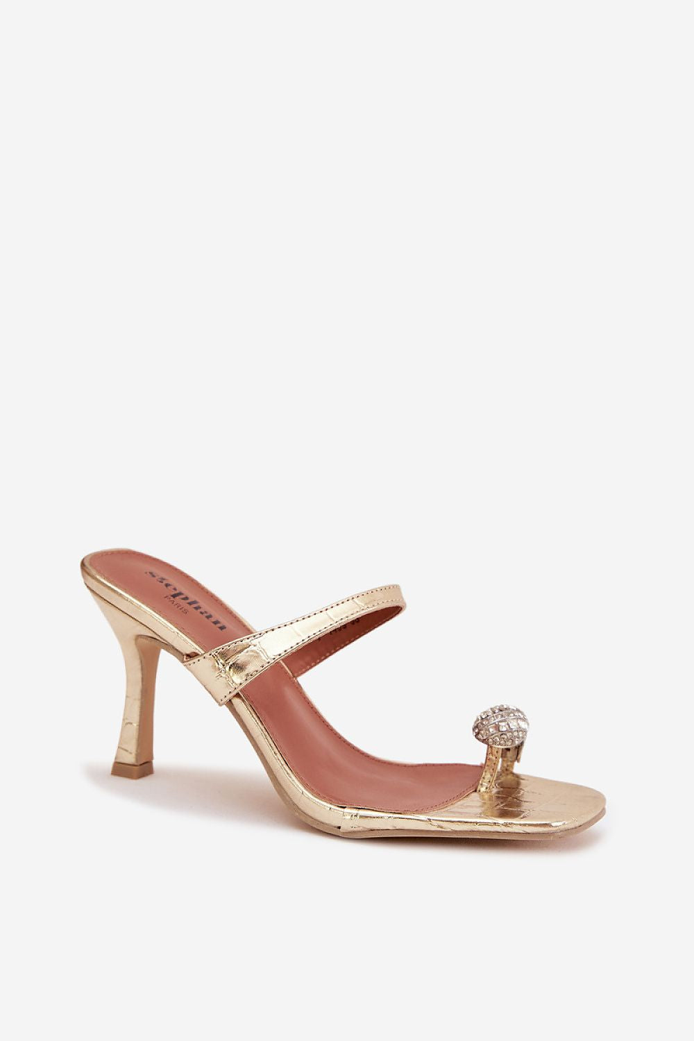 Gold high-heeled sandal with a decorative toe ring on a white background