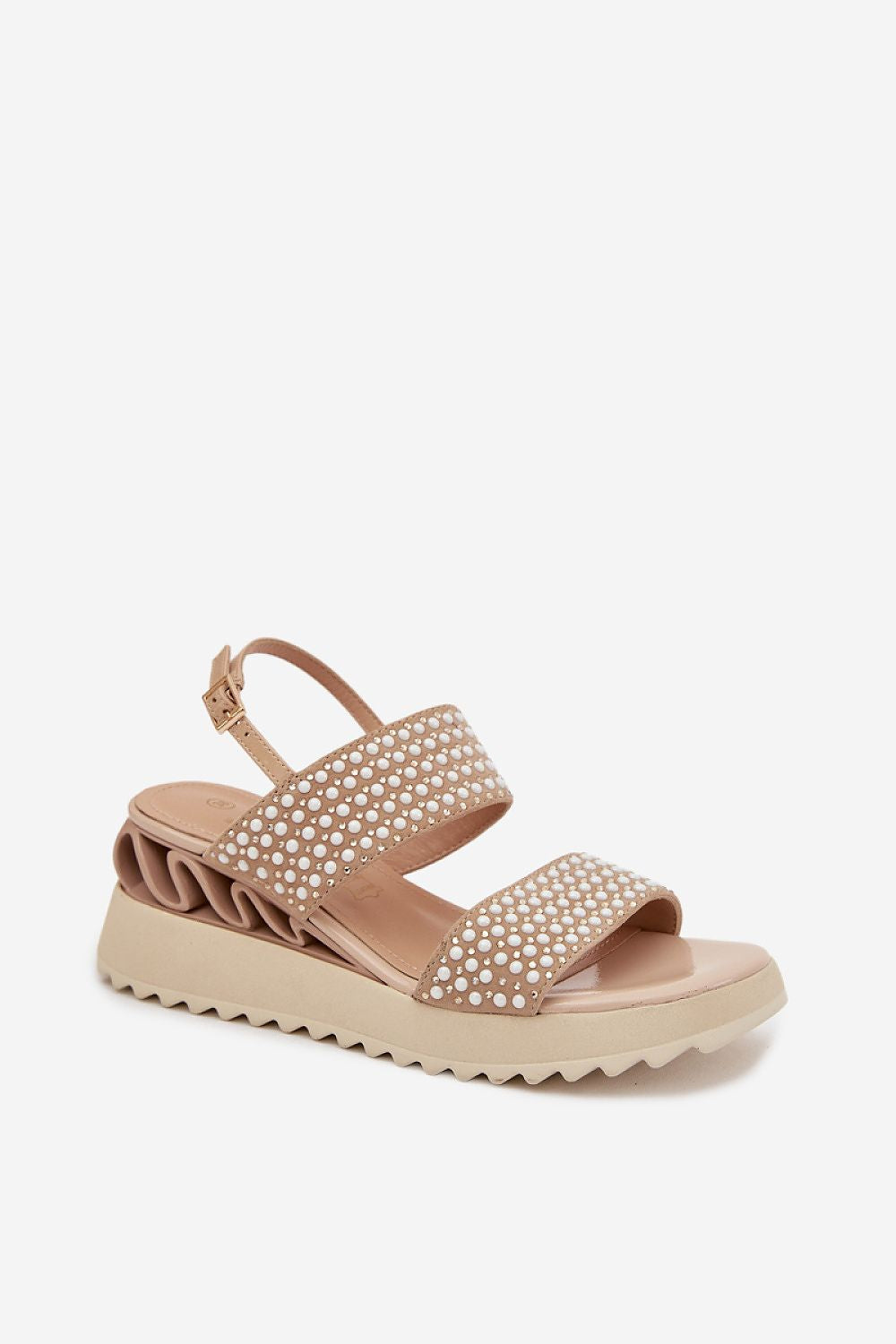 Beige sandal with embellishments on a white background