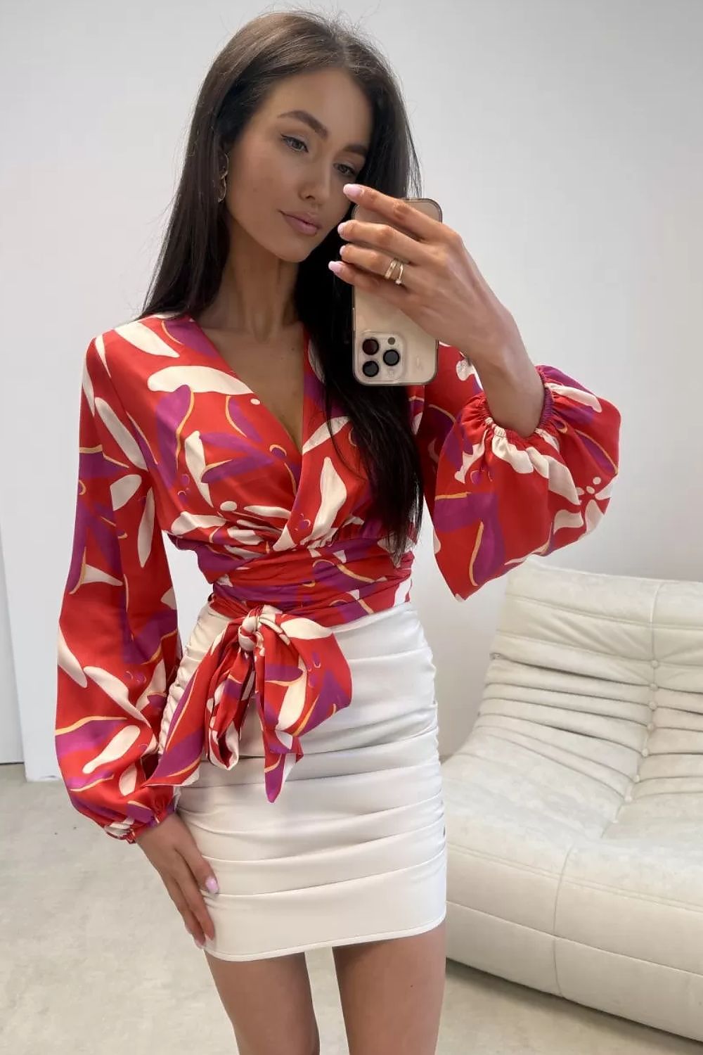  red wrap blouse with waist tie and decorative pattern