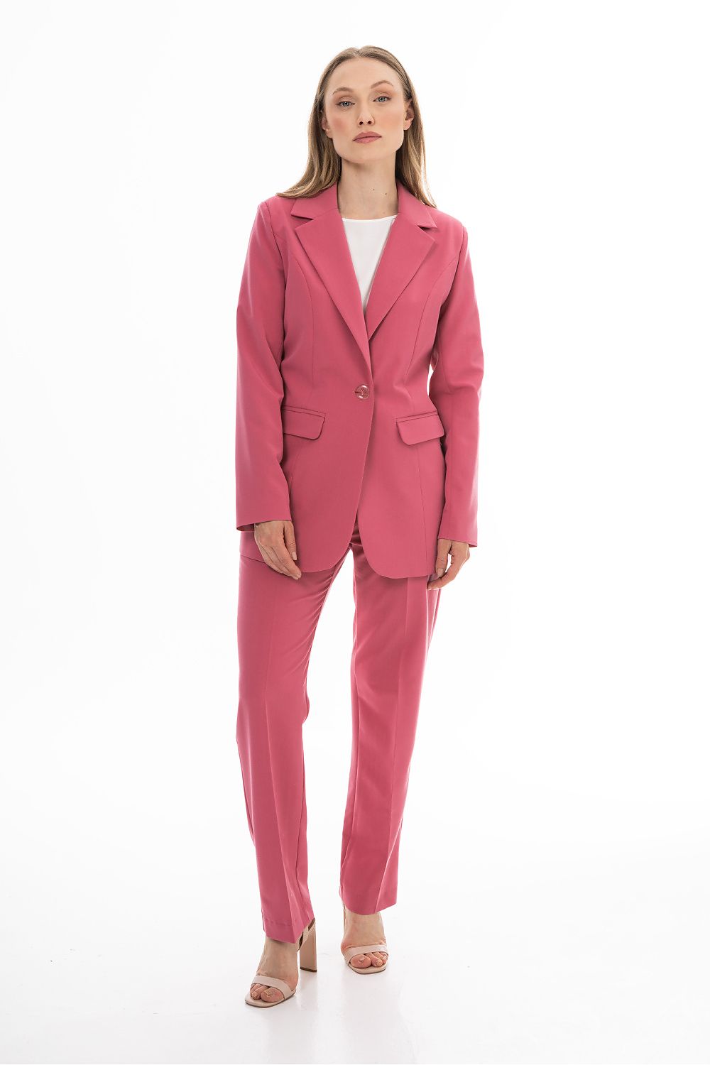 Woman wearing a pink suit on a white background