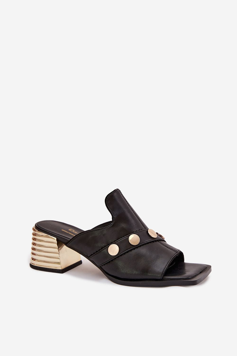 Black sandal with gold accents on a white background