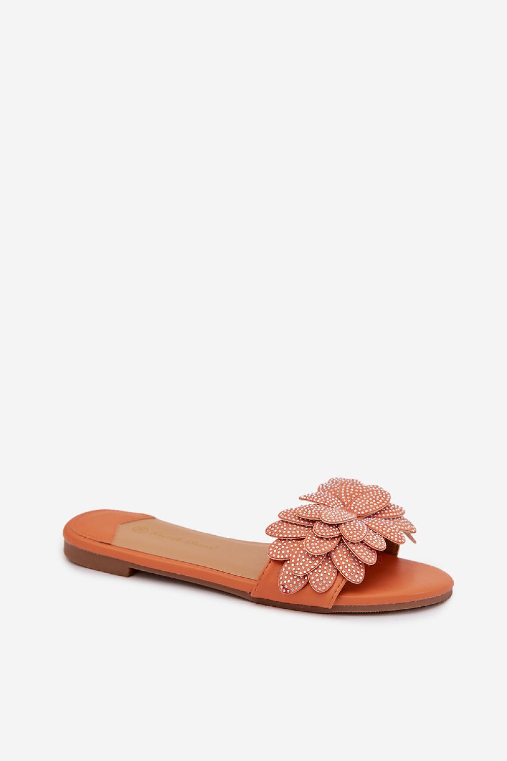Orange sandal with floral embellishments on a white background