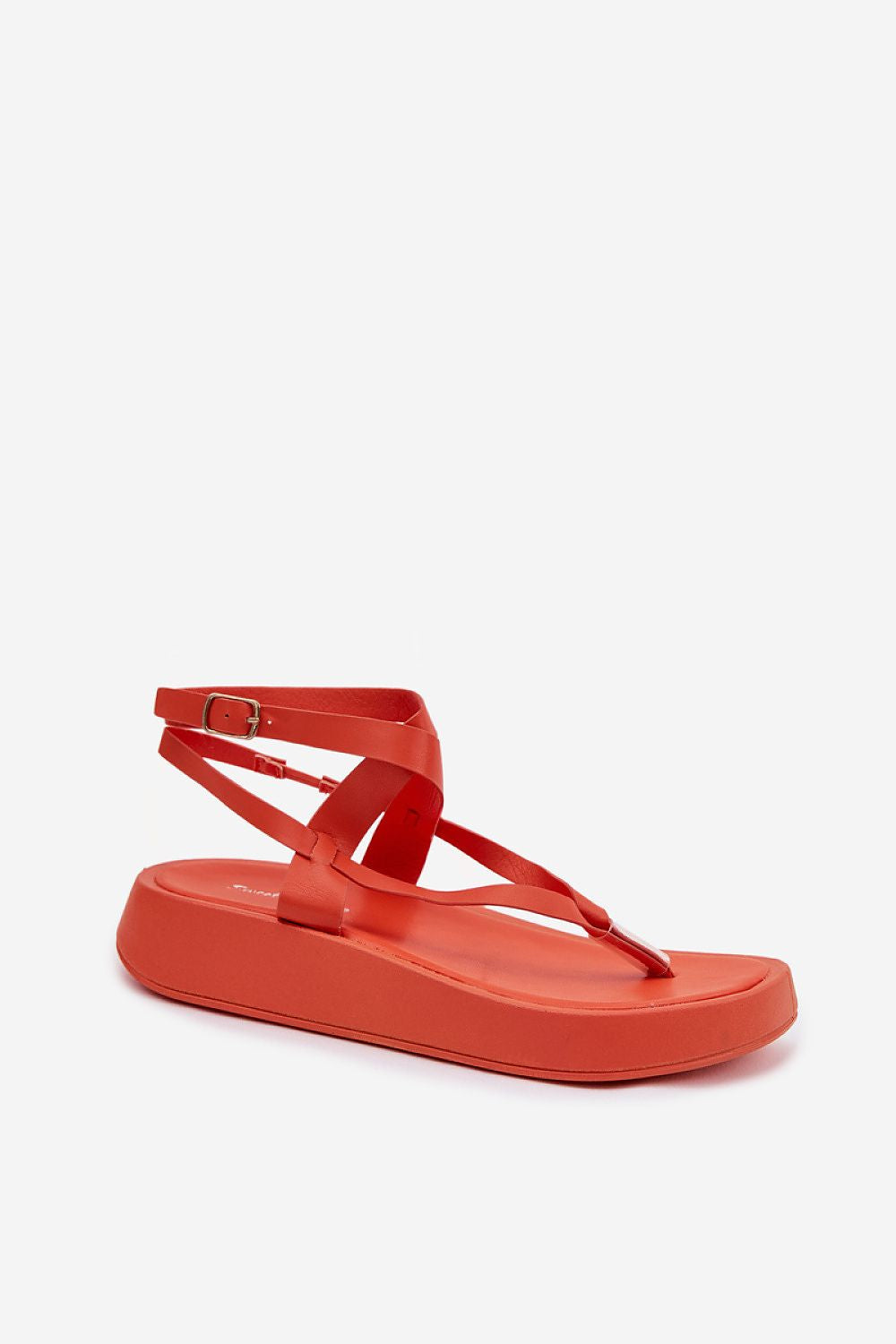 Orange sandal with thin straps on a white background
