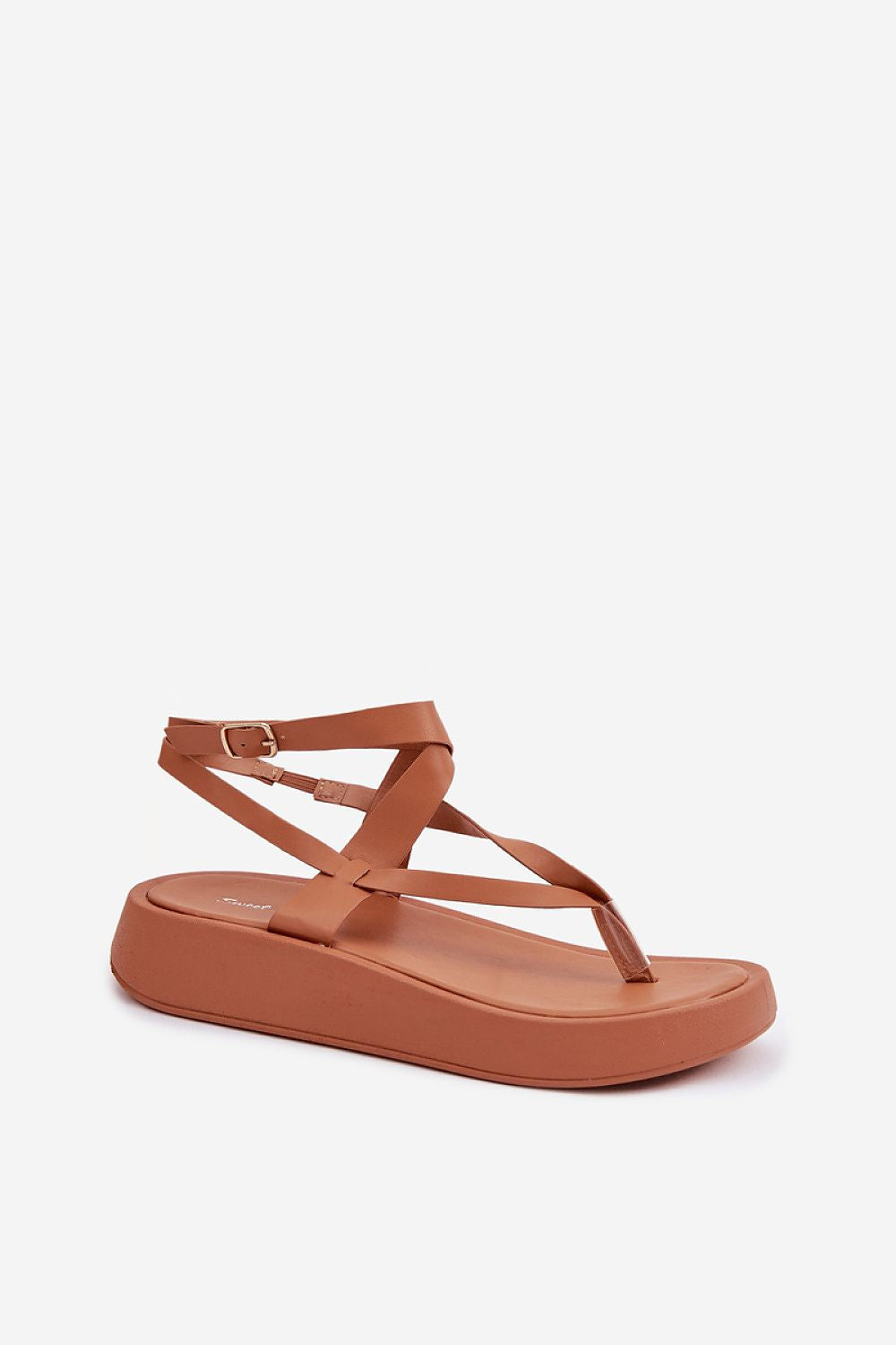 Brown sandal with thin straps on a white background