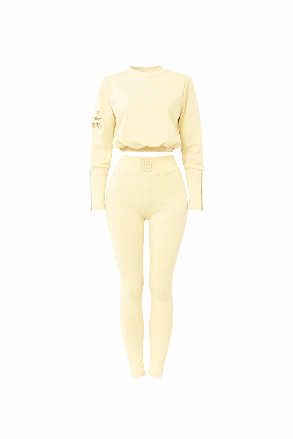 Light yellow long-sleeve top and pants set on a white background