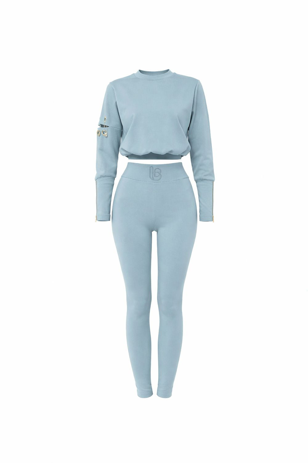 Light blue athletic outfit with long-sleeve top and leggings on a white background