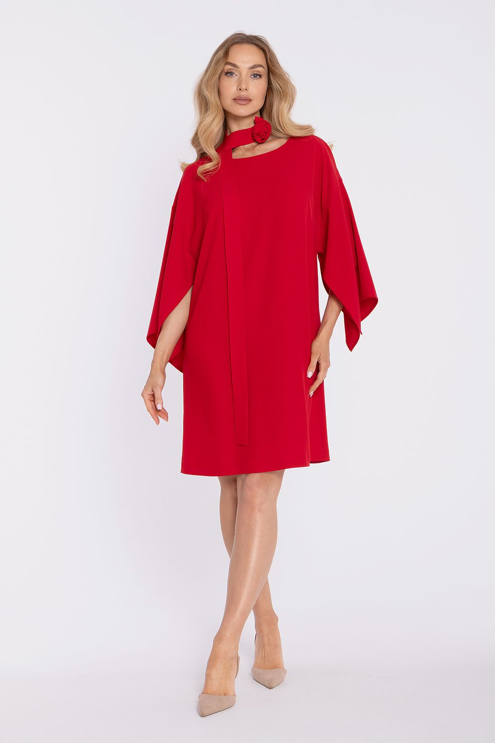Woman wearing a red dress on a white background