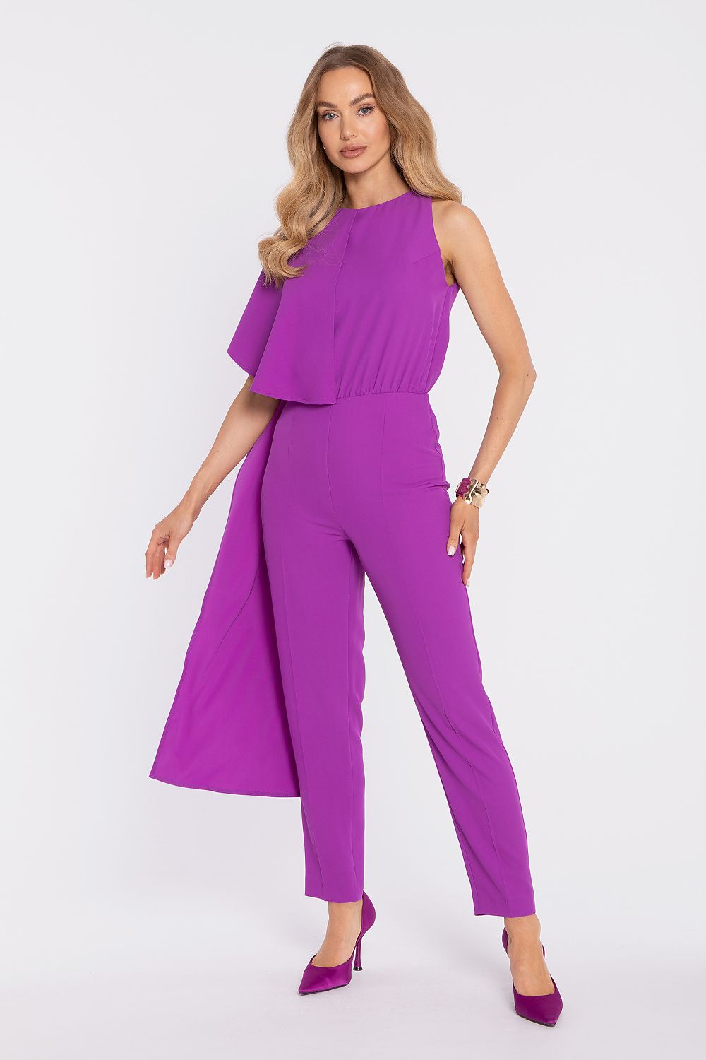 Woman wearing a purple jumpsuit on a white background
