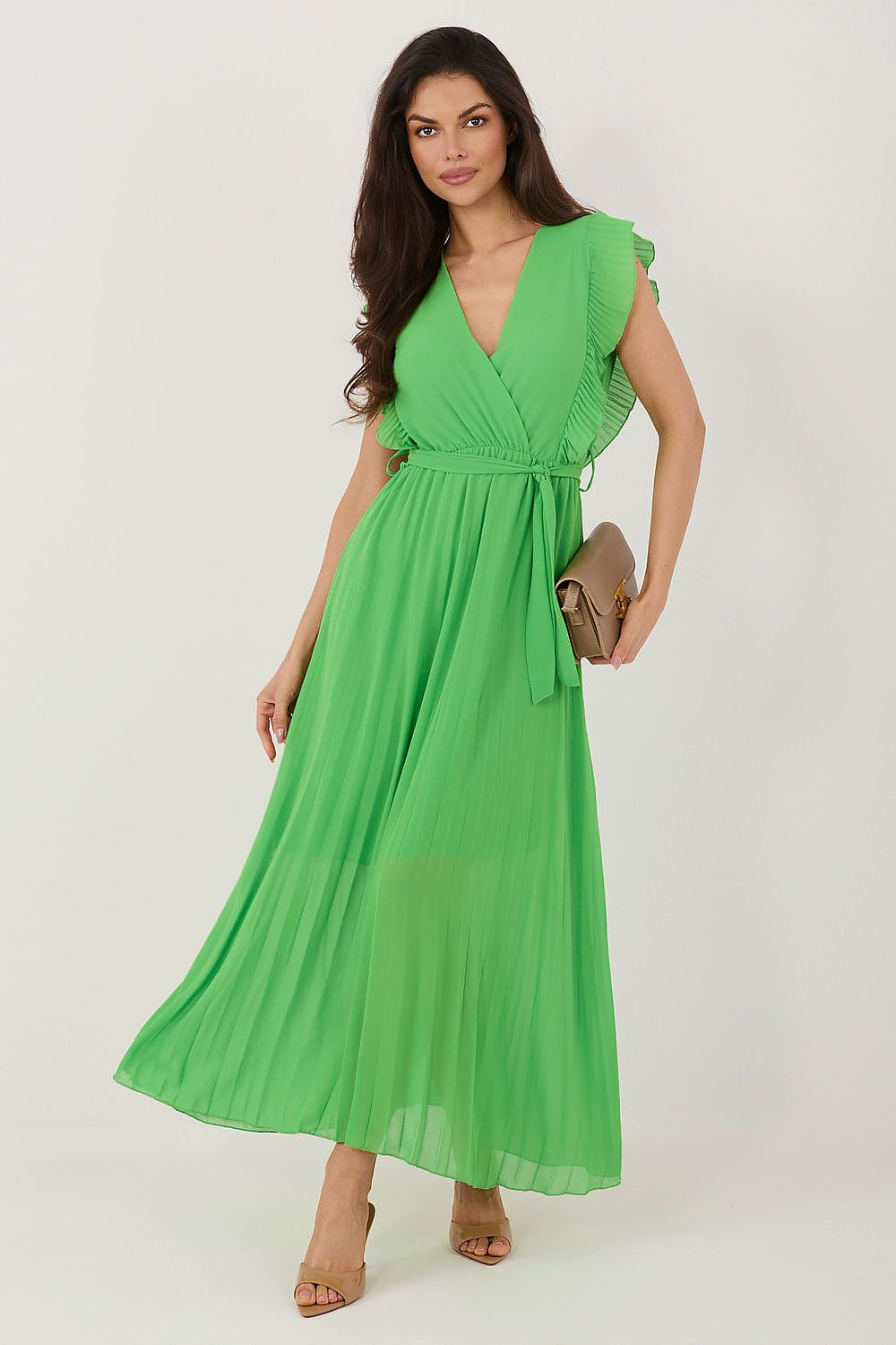 Woman wearing a green dress on a white background
