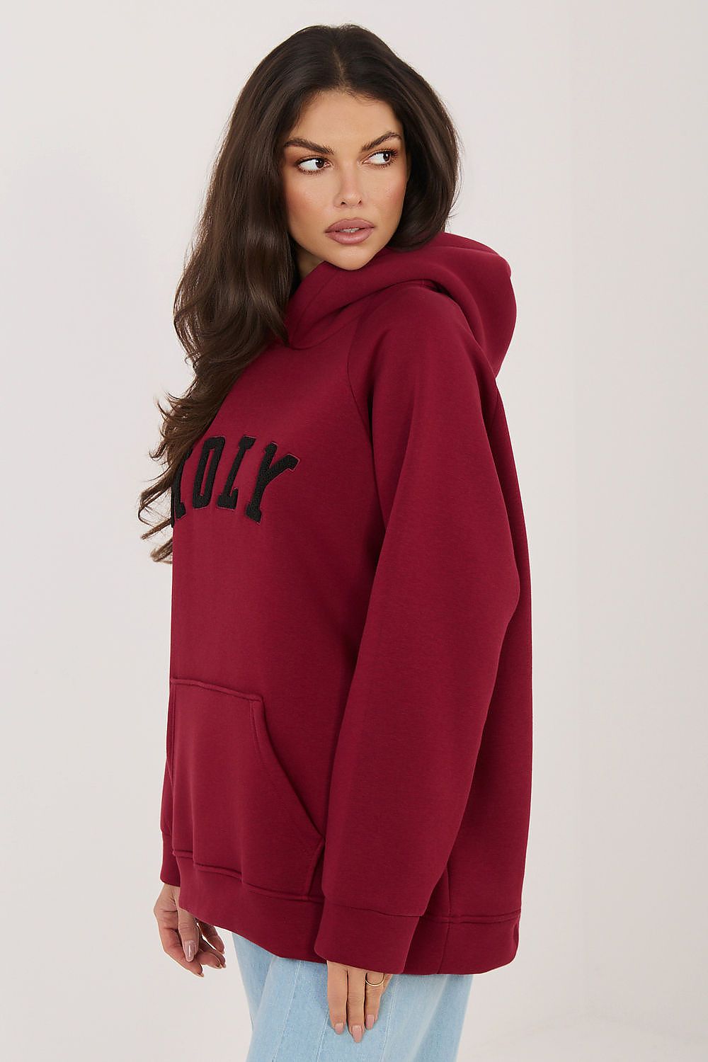  oversized hooded sweatshirt featuring bold HOLY lettering across the front.