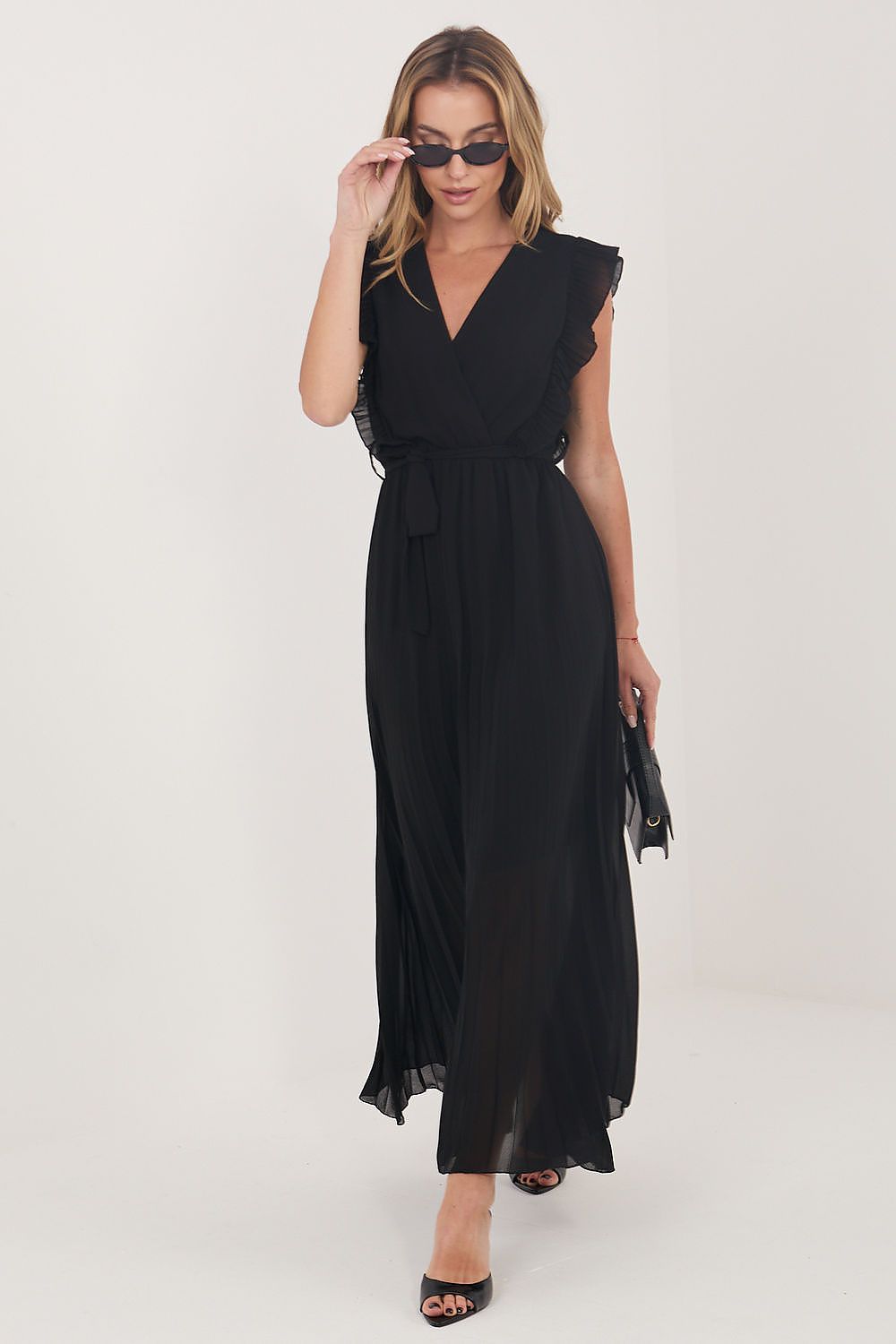Woman wearing a black dress on a white background