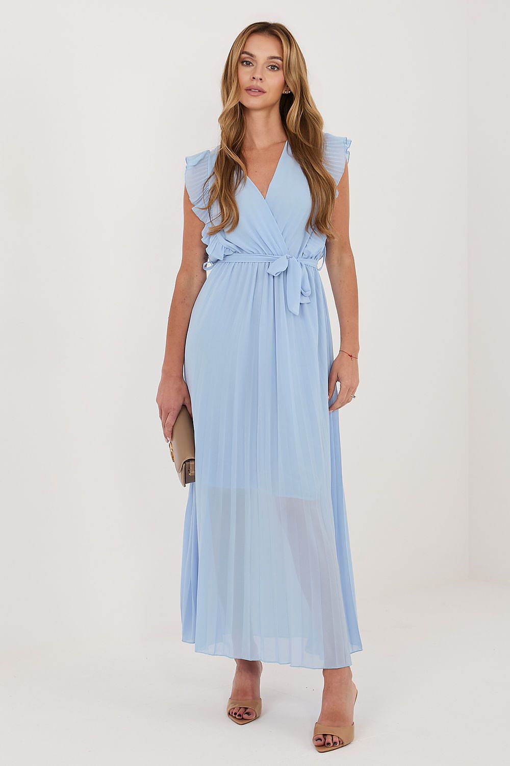 Woman wearing a light blue dress on a white background