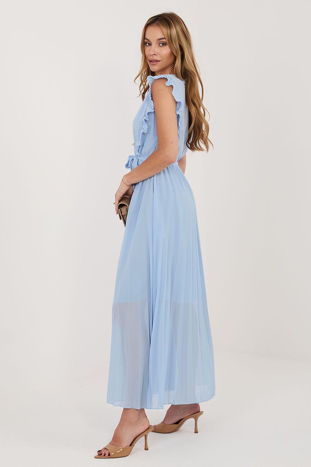 Woman wearing a light blue dress on a white background