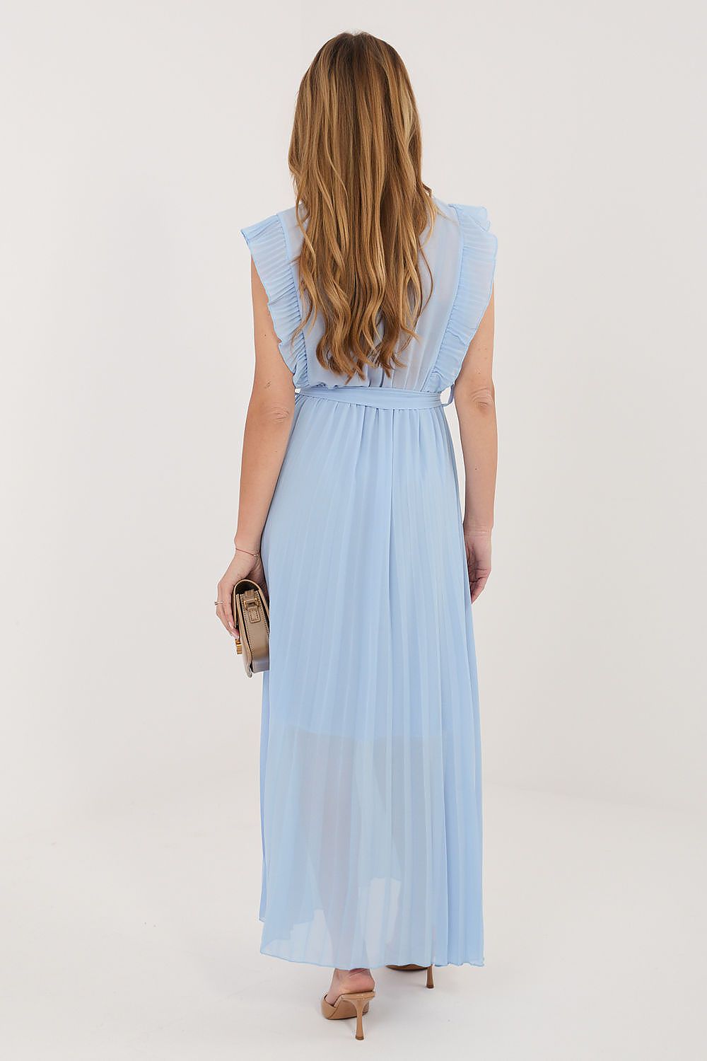 Woman wearing a light blue dress on a white background