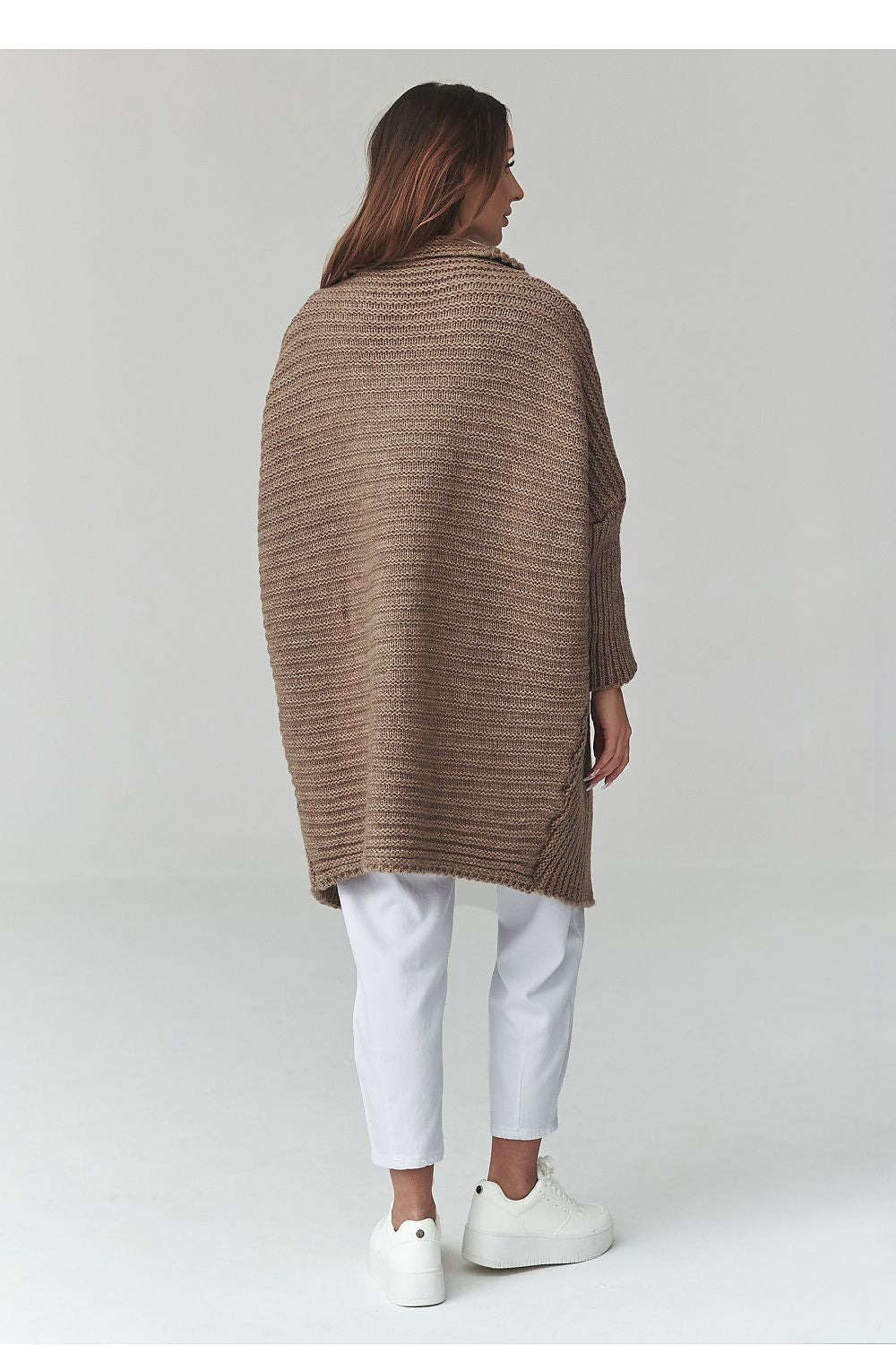  Women's longline oversized beige knitted cardigan with soft textured knit design.