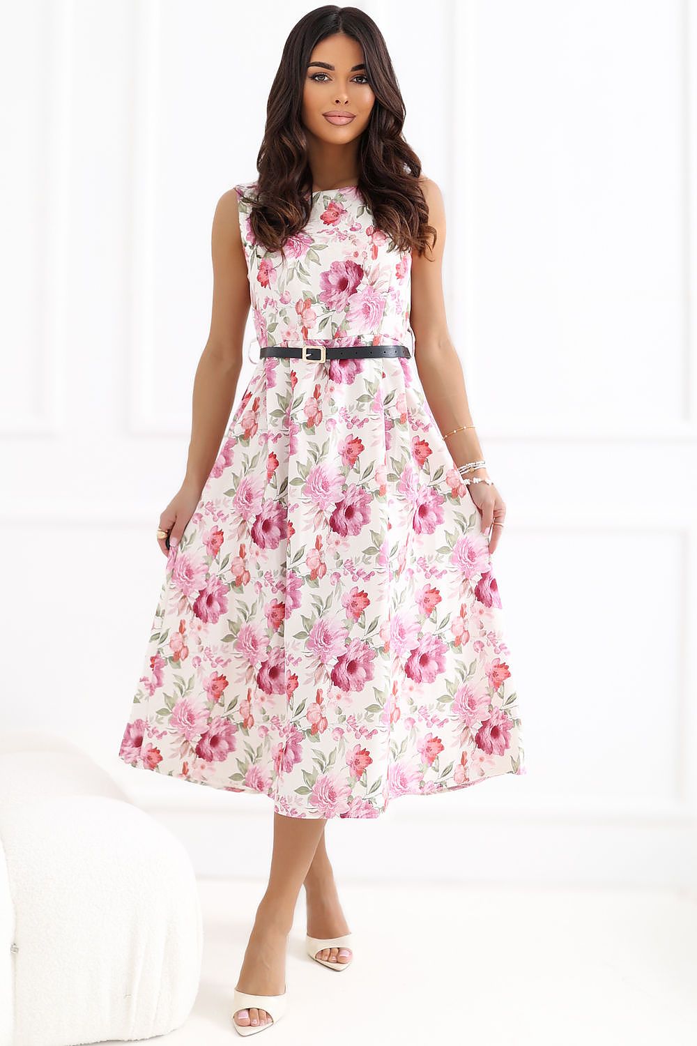 Woman wearing a floral dress with a white background