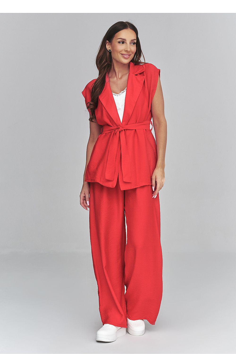 Woman wearing a red outfit with a white background