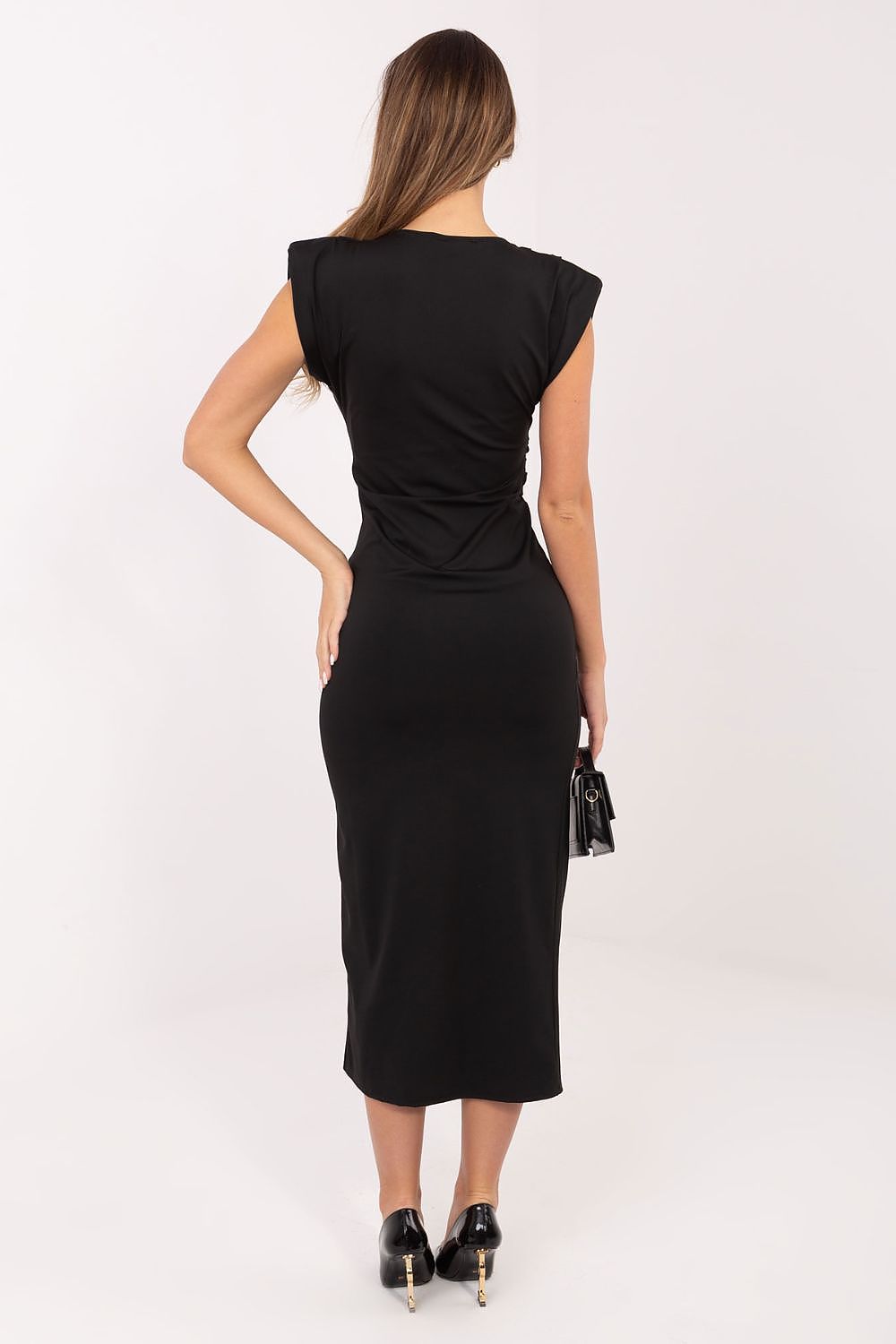 Woman wearing a black dress on a white background