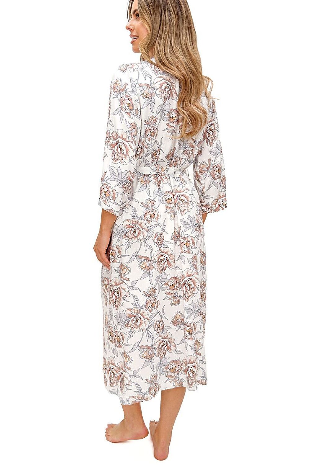 Woman wearing a floral patterned robe on a white background