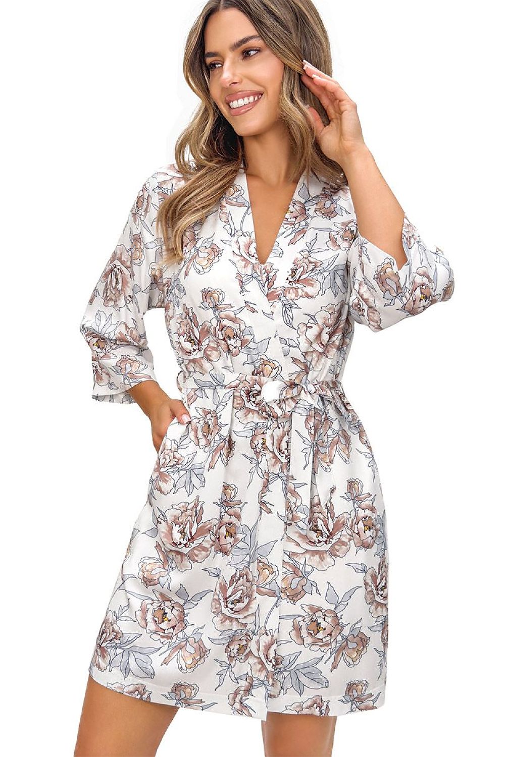 Woman wearing a floral patterned dress on a white background