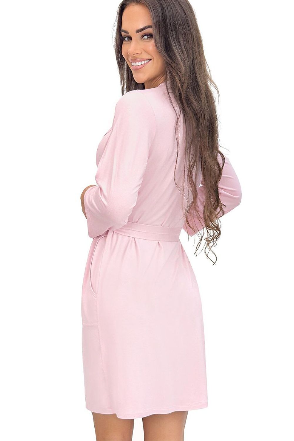 Woman wearing a pink satin robe on a white background