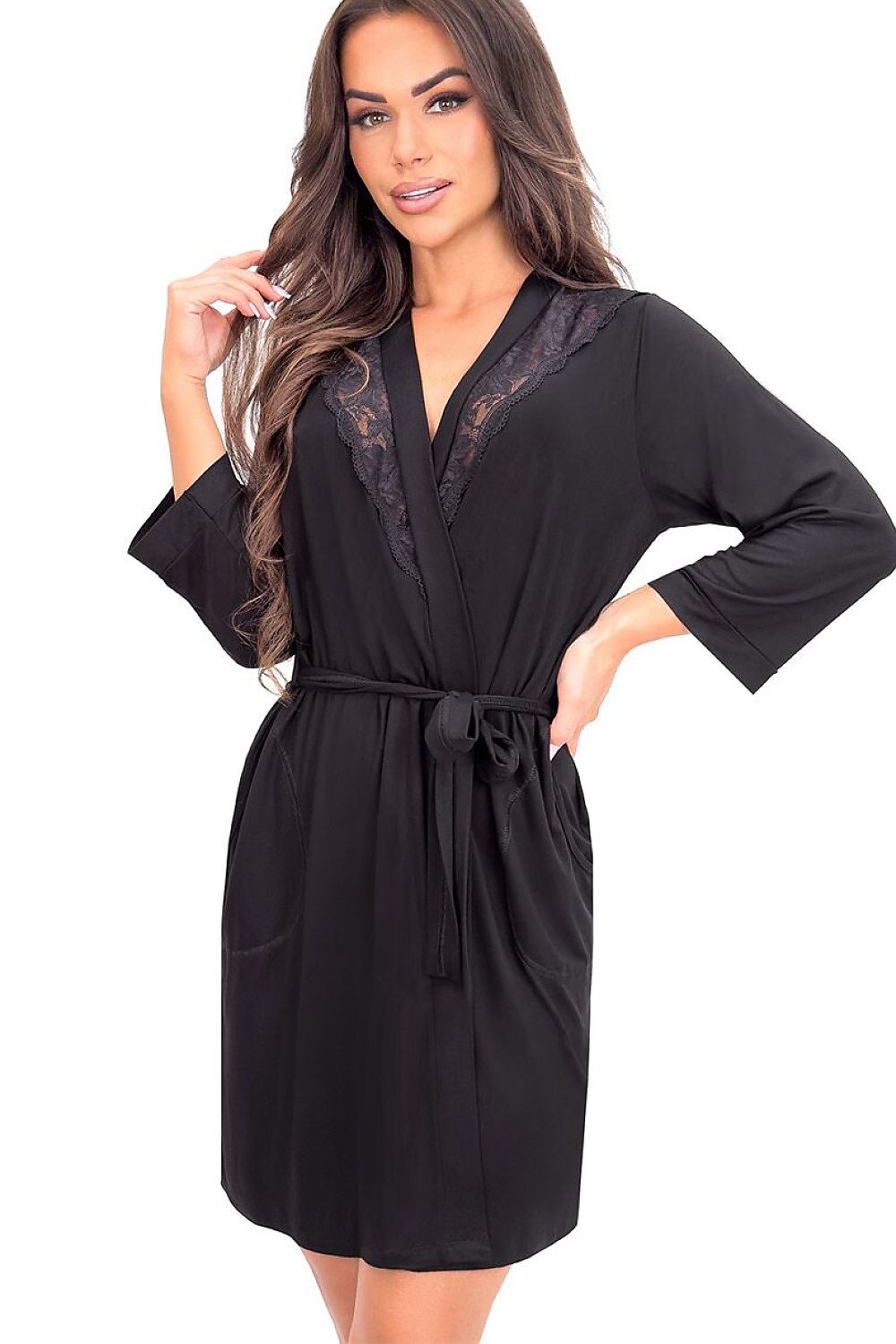 Woman wearing a black robe with lace trim on a white background