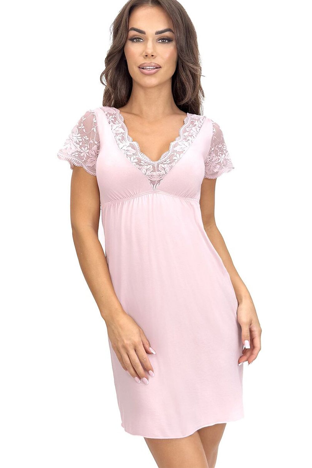 Woman wearing a pink nightgown with lace details on a white background