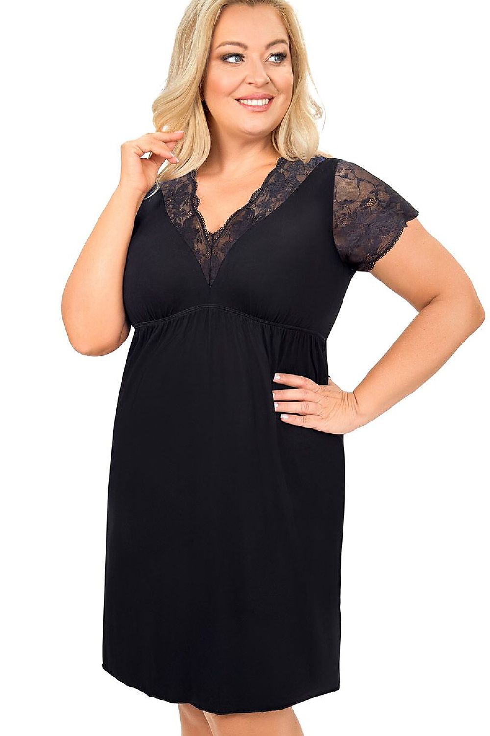 Woman wearing a black dress with lace details on a white background