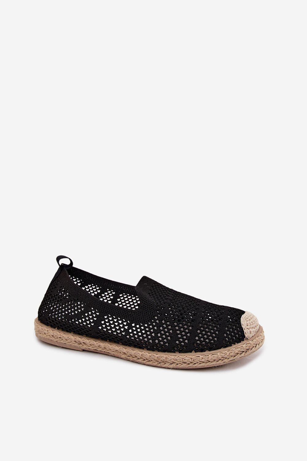 Black perforated espadrille shoe on a white background